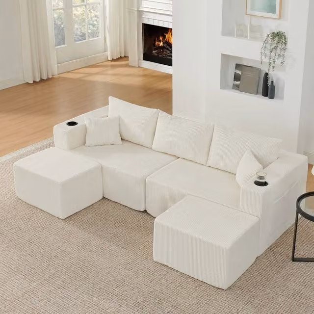 Divano angolare modulare Mivray a 3 posti in velluto a coste beige con pouf reversibili, portabicchieri e cuscini inclusi