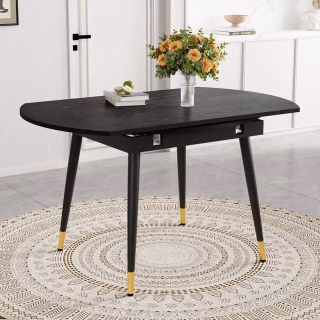Tavolo da pranzo allungabile rotondo trasformabile in ovale in MDF nero con gambe in metallo e dettagli dorati