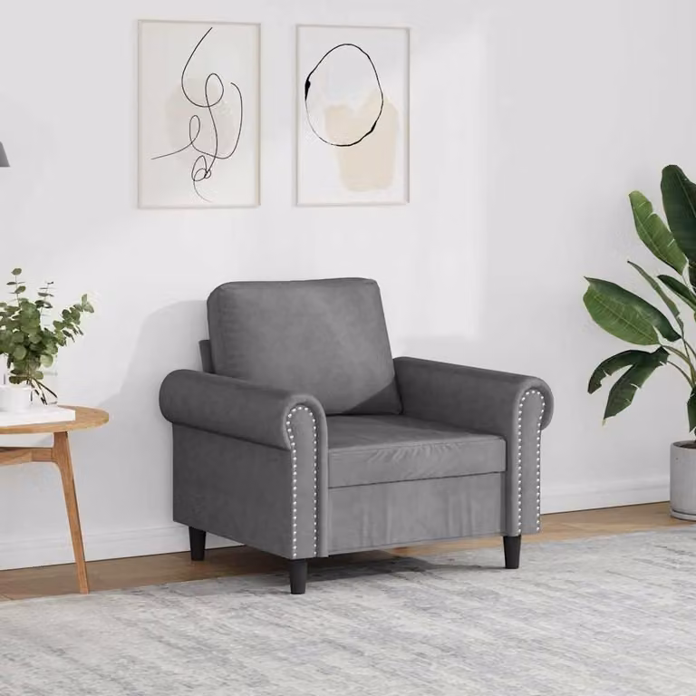 Poltrona di colore grigio scuro, altezza 60 cm, con rivestimento in velluto e struttura in metallo, ideale per il soggiorno e la zona living