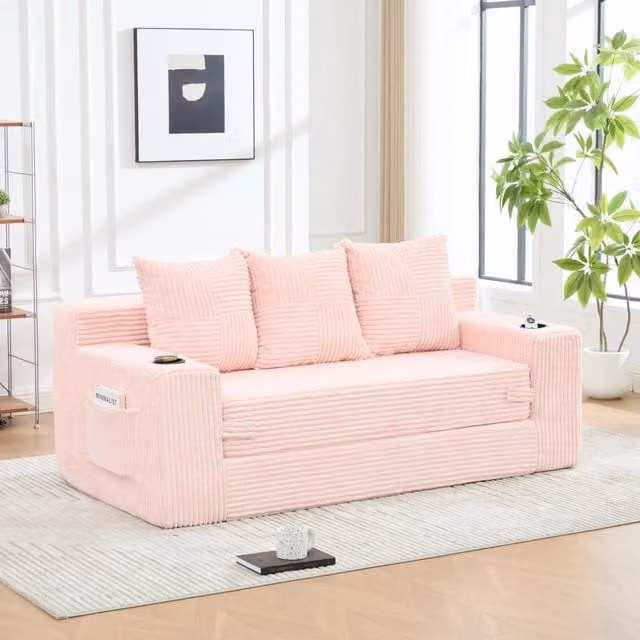 Divano tre posti in velluto a coste rosa; modulare salvaspazio con porta bicchieri