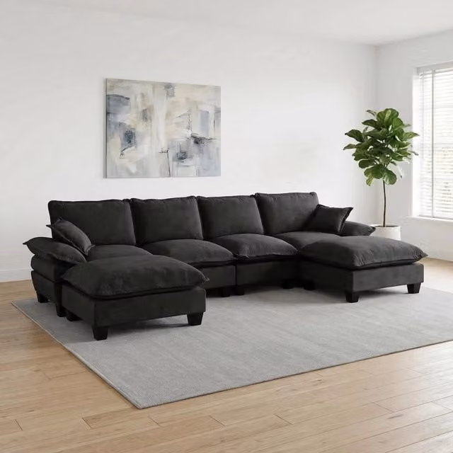 Divano modulare angolare a U OKWISH in tessuto nero con pouf coordinato, design moderno per soggiorno, L: 323 cm, P: 151 cm, H: 90 cm
