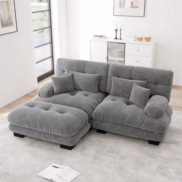 Divano modulare MIVRAY in tessuto grigio con ottomane mobili e cuscini coordinati, configurabile ad angolo o a U per il tuo soggiorno