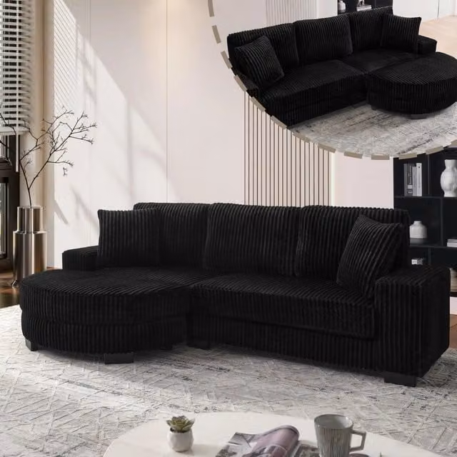 Divano angolare MIVRAY a 4 posti con pouf ovale reversibile in tessuto effetto velluto a coste nero H: 89 cm, L: 256.5 cm, P: 133.5 cm