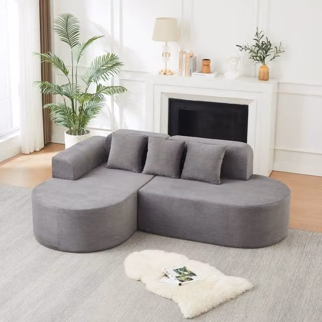 Divano angolare in velluto a coste con linee curve e braccioli sagomati grigio 220 × 155 × 70 cm