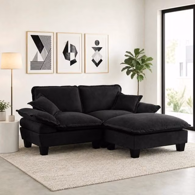 Divano angolare reversibile MIVRAY in tessuto nero con ottomana coordinata e cuscini inclusi, L/P/H: 194 x 155 x 90 cm