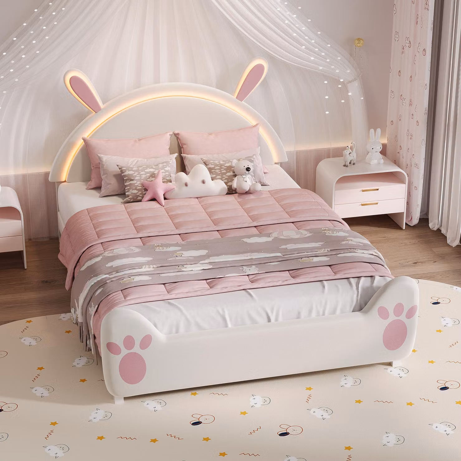 Letto imbottito per bambini UnboxG 140x200 cm con motivo a coniglietto e illuminazione d'atmosfera a LED, morbido tessuto in velluto e motivo a zampe, struttura sicura per la cameretta delle bambine
