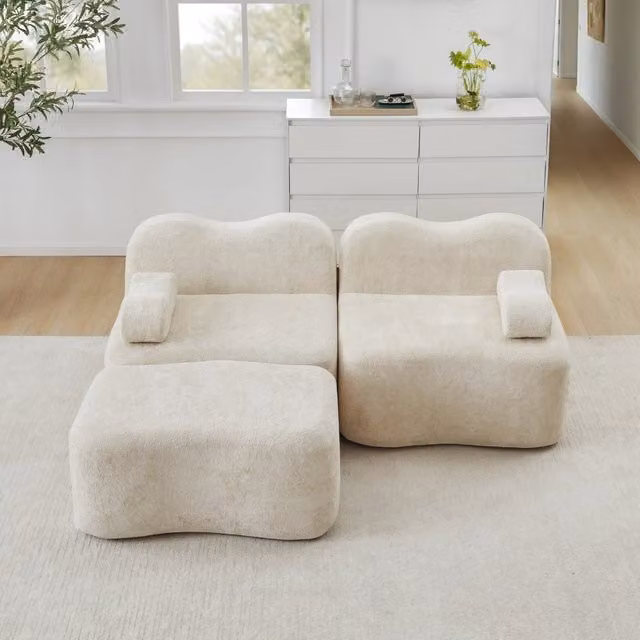 Divano angolare modulare senza struttura con ottomano e braccioli mobili in velluto beige per soggiorno e appartamento