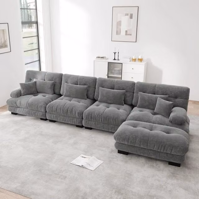 Divano angolare modulare OKWISH a 4 posti con ottomani e cuscini decorativi, design moderno effetto cloud in tessuto grigio