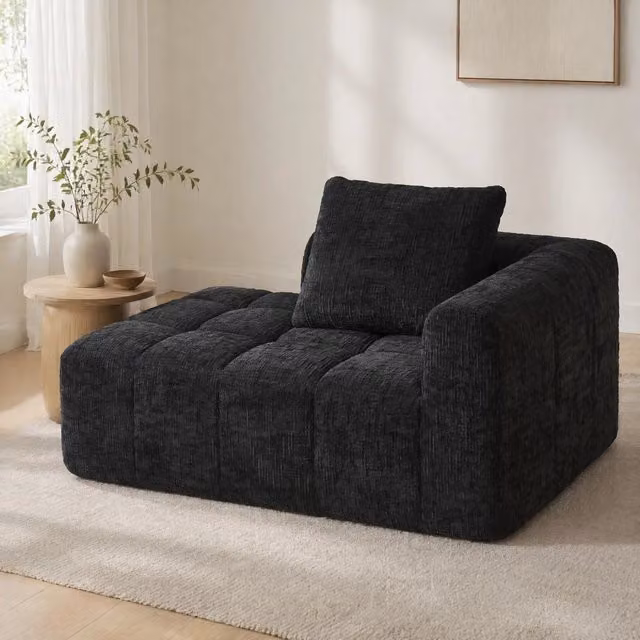 Divano chaise longue in ciniglia nera con cuscino e tasche laterali; 158x90x60 cm