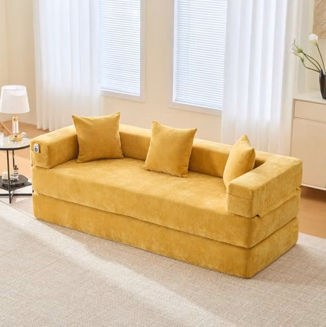 Divano modulare in ciniglia con tasche laterali; funzione letto e base antiscivolo; giallo senape