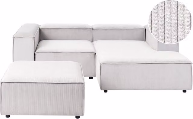 Divano angolare modulare Beliani in velluto a coste bianco con pouf, modello moderno a 3 posti con lato sinistro, L/P/H: 240 x 180 x 110 cm