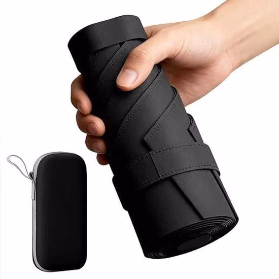 Ombrello compatto, resistente al vento e all'acqua, ideale per i viaggi, di dimensioni ridotte, con protezione UV 50+ e ripiegabile per essere trasportato in una custodia.