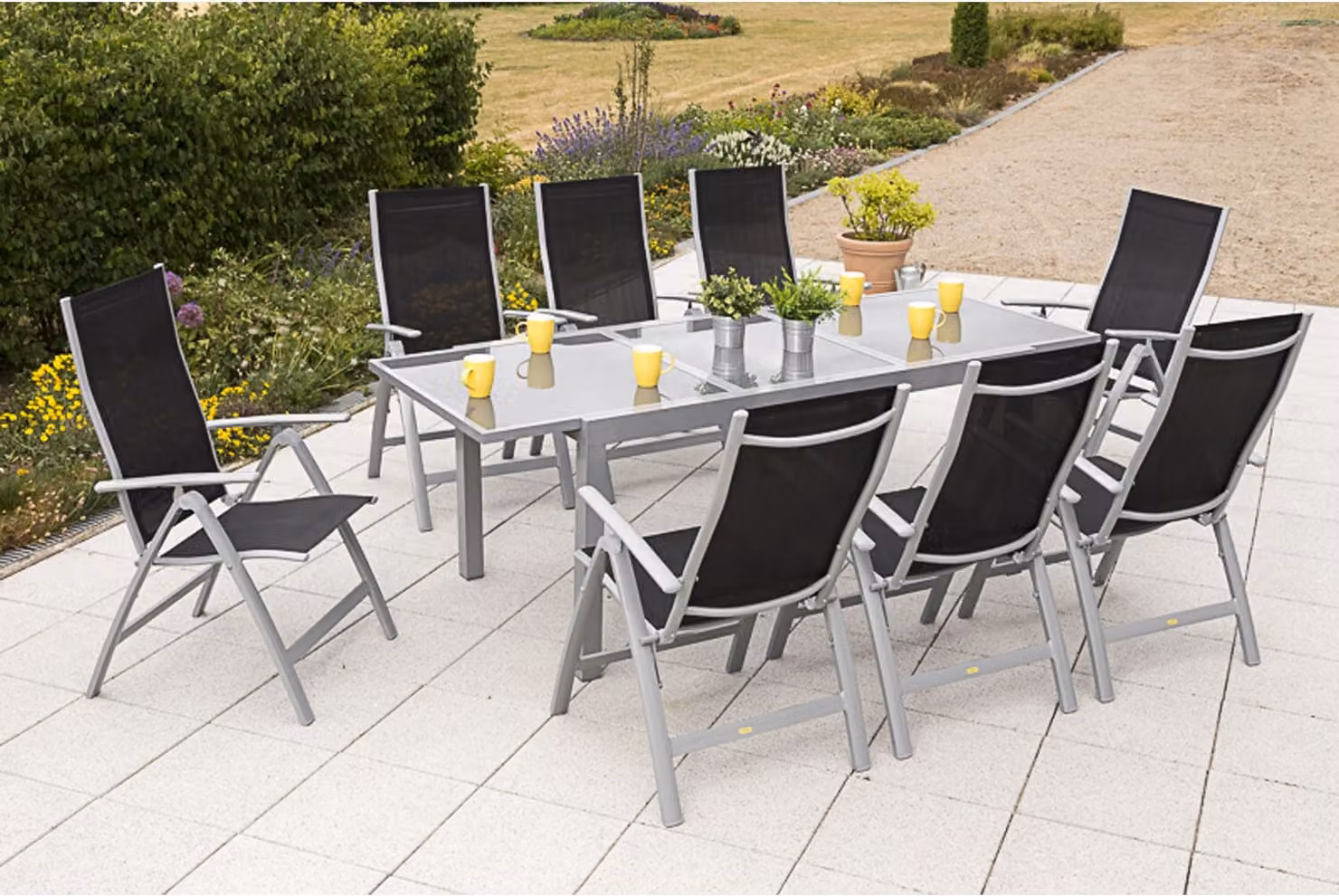 Set di mobili da giardino Merxx "Carrara" 9 pezzi con tavolo allungabile 160/220 x 90 cm - struttura in alluminio argento con rivestimento in tessuto nero