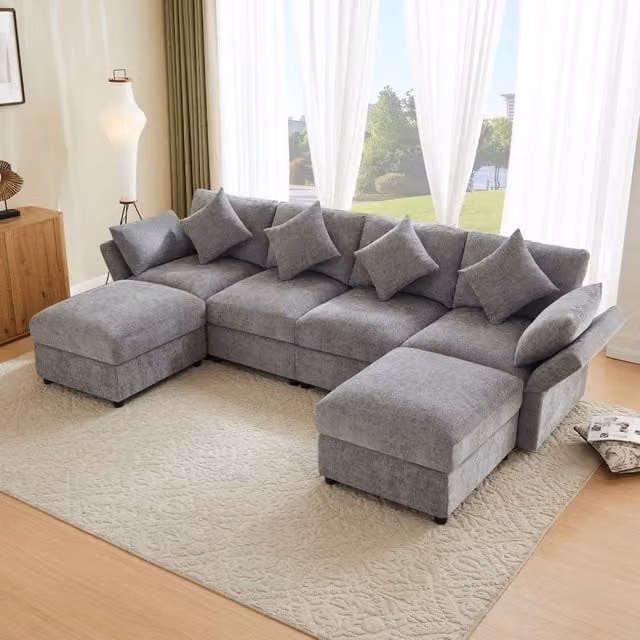 Divano angolare modulare MIVRAY a 4 posti in tessuto grigio con pouf coordinato, braccioli e poggiatesta regolabili, reversibile, L/P/H: 284 x 86 x 156,5 cm