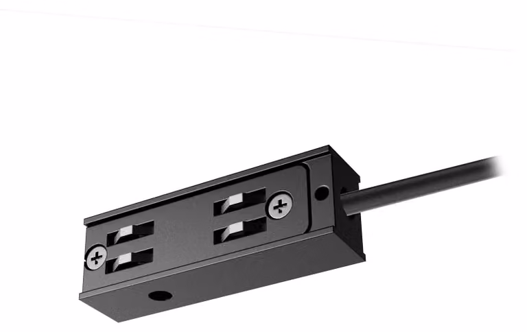 ALIMENTATORE ARELUX XNET con cavo da 2,5 metri, collegato tra il profilo curvo di ricezione/superficie e il profilo curvo/lineare