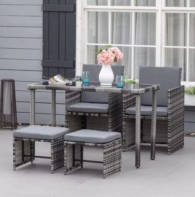 Salotto da giardino 5 pezzi in polyrattan grigio con tavolo in vetro temperato