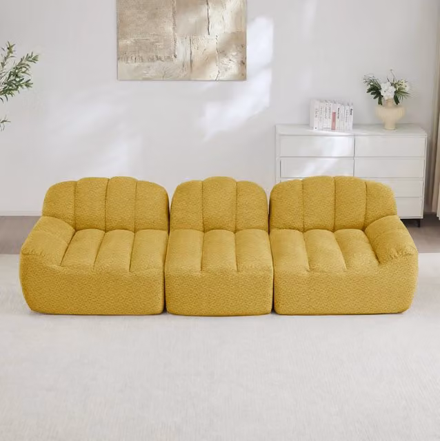 Divano angolare modulare senza struttura in fleece granulato giallo; schiuma 32D