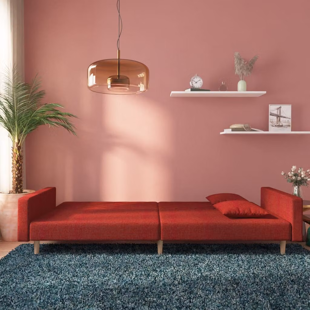 Divano letto 2 posti, rivestito in tessuto color borgogna, con 2 cuscini