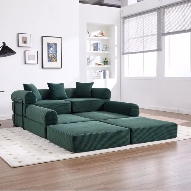 Divano modulare con funzione letto MIVRAY in velluto a coste verde smeraldo con forma a L e tasca laterale