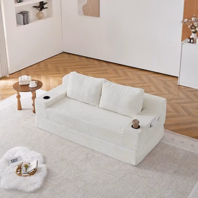 Divano letto 2 posti Minimal in tessuto beige con 2 cuscini, portabibite e tasche portaoggetti – 1