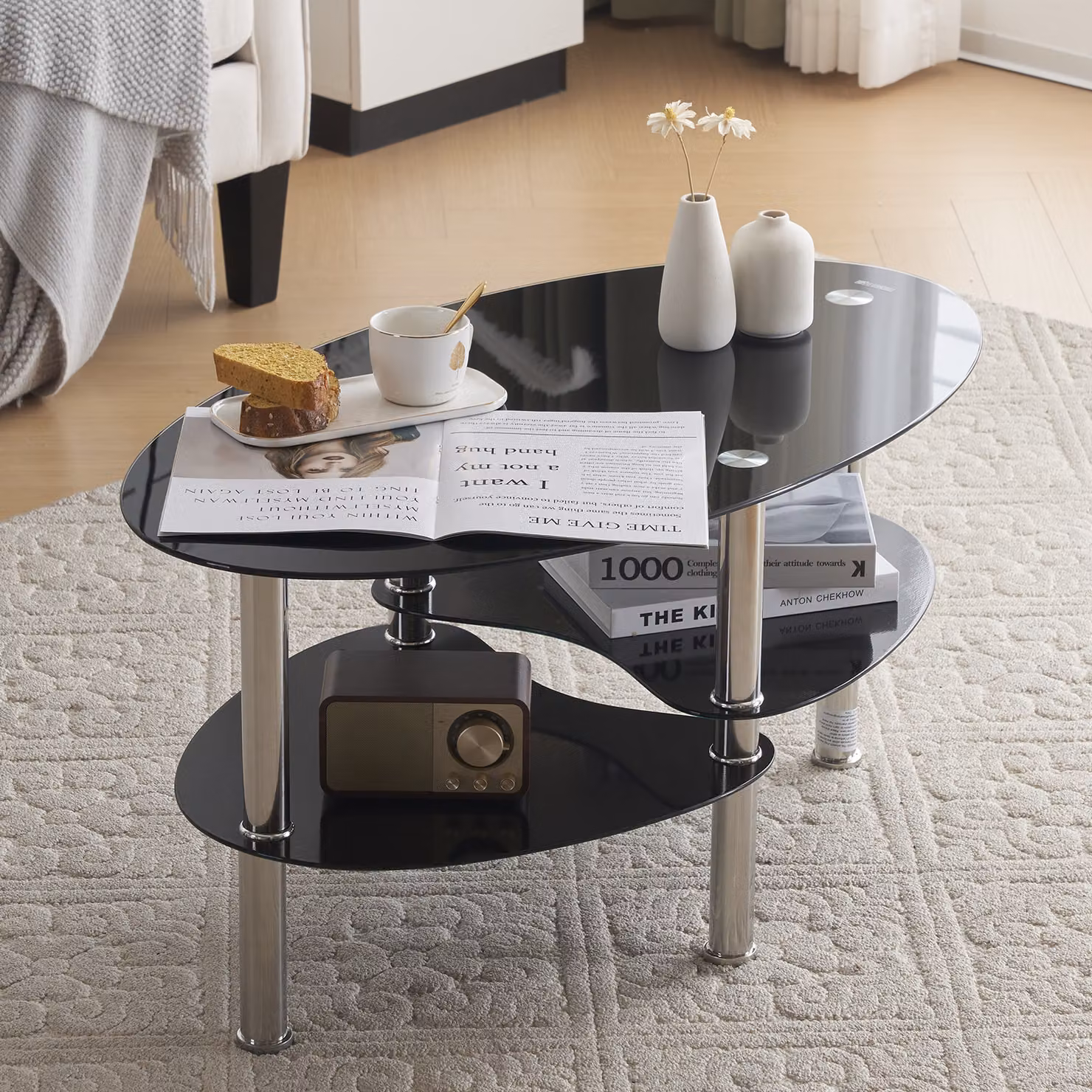 Tavolino ovale Alightup, piano in vetro, struttura in acciaio, colore nero, dimensioni 90x50x45 cm