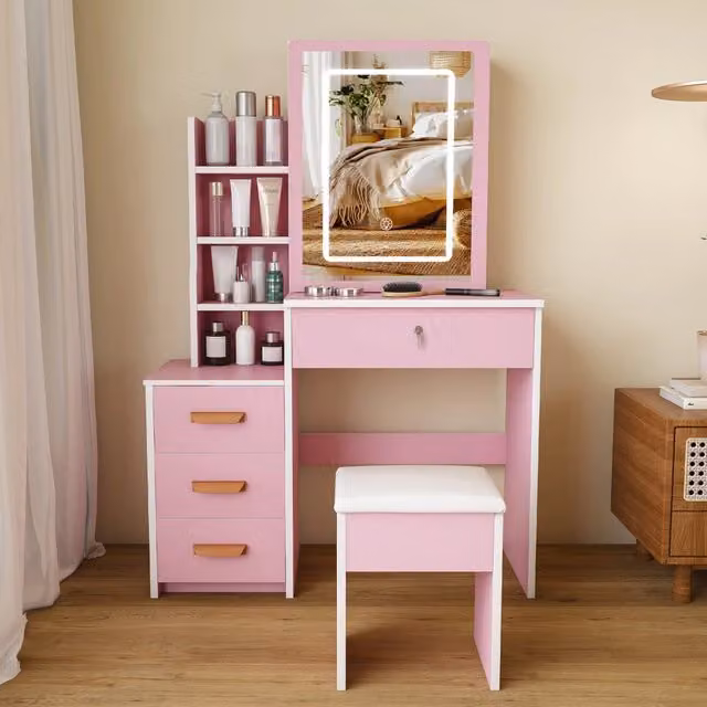 Toeletta con specchio LED e sgabello in MDF rosa con cassetti; ripiani laterali e ante scorrevoli a specchio