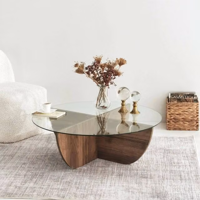 Tavolino da salotto rotondo DMORA Jolanda con piano in vetro trasparente e struttura in legno marrone, L/P/H: 90 x 90 x 30 cm