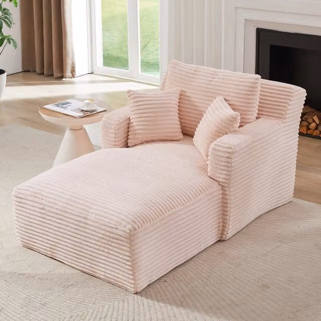 Poltrona letto FOLYNA in velluto a coste rosa con schienale a tuffante e braccioli per relax in soggiorno o ufficio