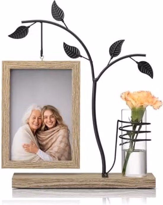 Cornice fotografica con piccole fioriere in vetro su supporto in legno