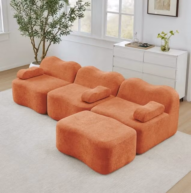Divano angolare modulare in velluto arancione con pouf; seduta profonda 288x167x70 cm