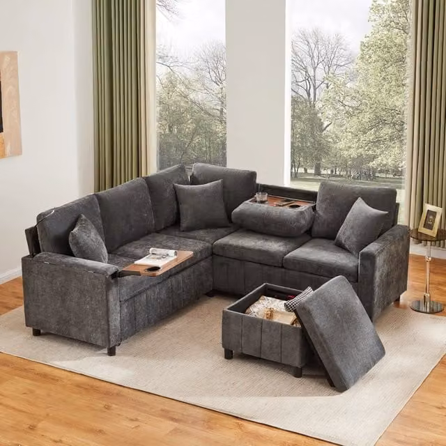 Divano angolare convertibile con letto OKWISH in chenille grigio con porte USB e Type-C e pouf contenitore L/P/H: 205 x 205 x 85 cm
