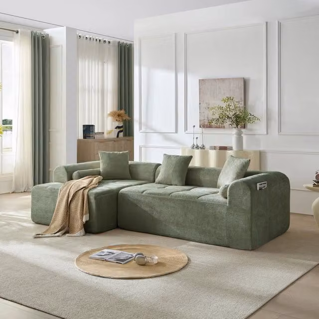 Divano verde in ciniglia con molle e tasca laterale; 263 × 132;5 × 68 cm