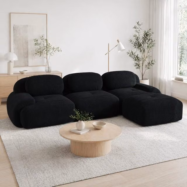 Divano angolare modulare senza montaggio in velluto a coste nero; design ergonomico e struttura senza telaio