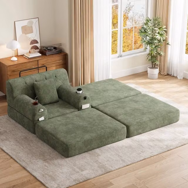 Letto a sedile convertibile 1 con pouf; schienale alto; portabicchieri 2 e tasche laterali 4; velluto a coste; verde