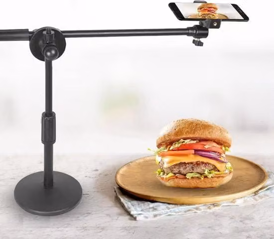 Stativo per smartphone e fotocamera da tavolo nero, regolabile in altezza e angolo con base stabile a rullo