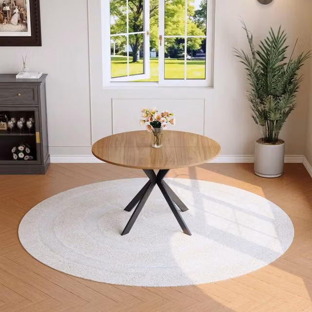 Tavolo da pranzo rotondo con struttura a X, piano in MDF effetto noce e base in metallo nero, diametro 110 cm