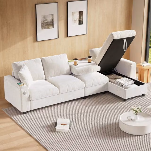 Divano angolare con letto OKWISH in ciniglia beige con tavolino ribaltabile, porta bicchieri, porte USB e contenitori nei braccioli L/P/H: 280 x 137 x 84 cm