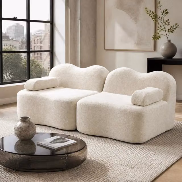 Divano angolare modulare senza struttura in velluto beige; forma ondulata