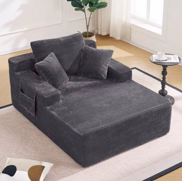 Divano da relax in tessuto a coste grigio scuro con tasche laterali HOMVRA