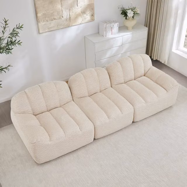 Divano angolare modulare MIVRAY in tessuto bouclé beige e bianco con ottomana coordinata, design moderno reversibile per il tuo soggiorno