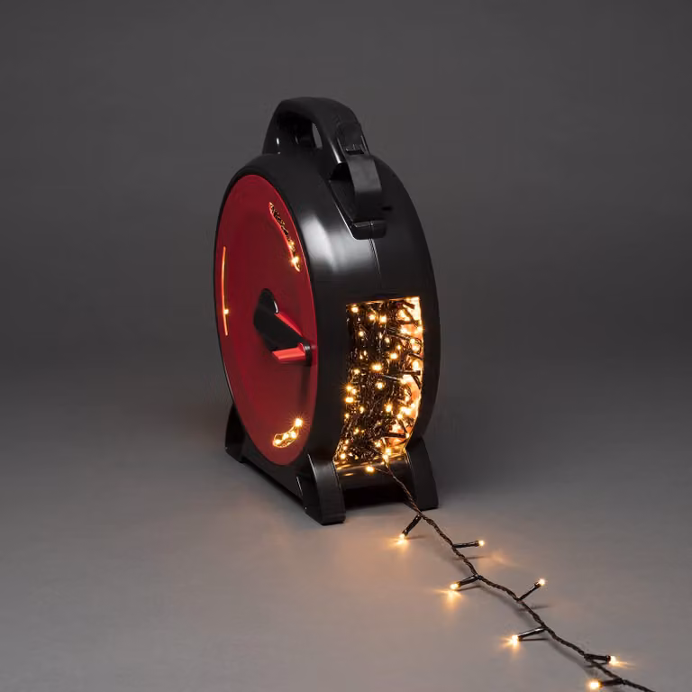 Konstsmide Micro LED con avvolgicavo, 1000 diodi color ambra, 30V, per esterni (IP44), cavo morbido nero - 3839-807
