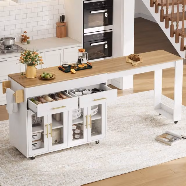 Isola cucina mobile Vovees Living con ruote e tavolo bar estraibile, ante in vetro, cassetti e ripiani, finitura bianca opaca, L/P/H: 132,5 x 50 x 93 cm – 1