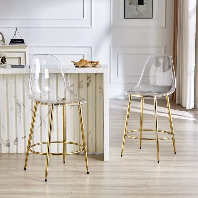 Set di 2 sgabelli da bar MIVRAY trasparenti in plastica con gambe in metallo dorato e poggiapiedi integrato per cucina e soggiorno