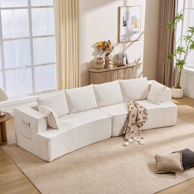 Divano modulare curvo con seduta profonda e molle rinforzate dal design moderno in velluto a coste bianco