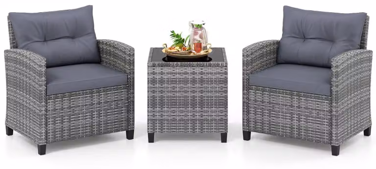 Set da giardino in rattan composto da 3 pezzi con cuscini e tavolo in vetro.