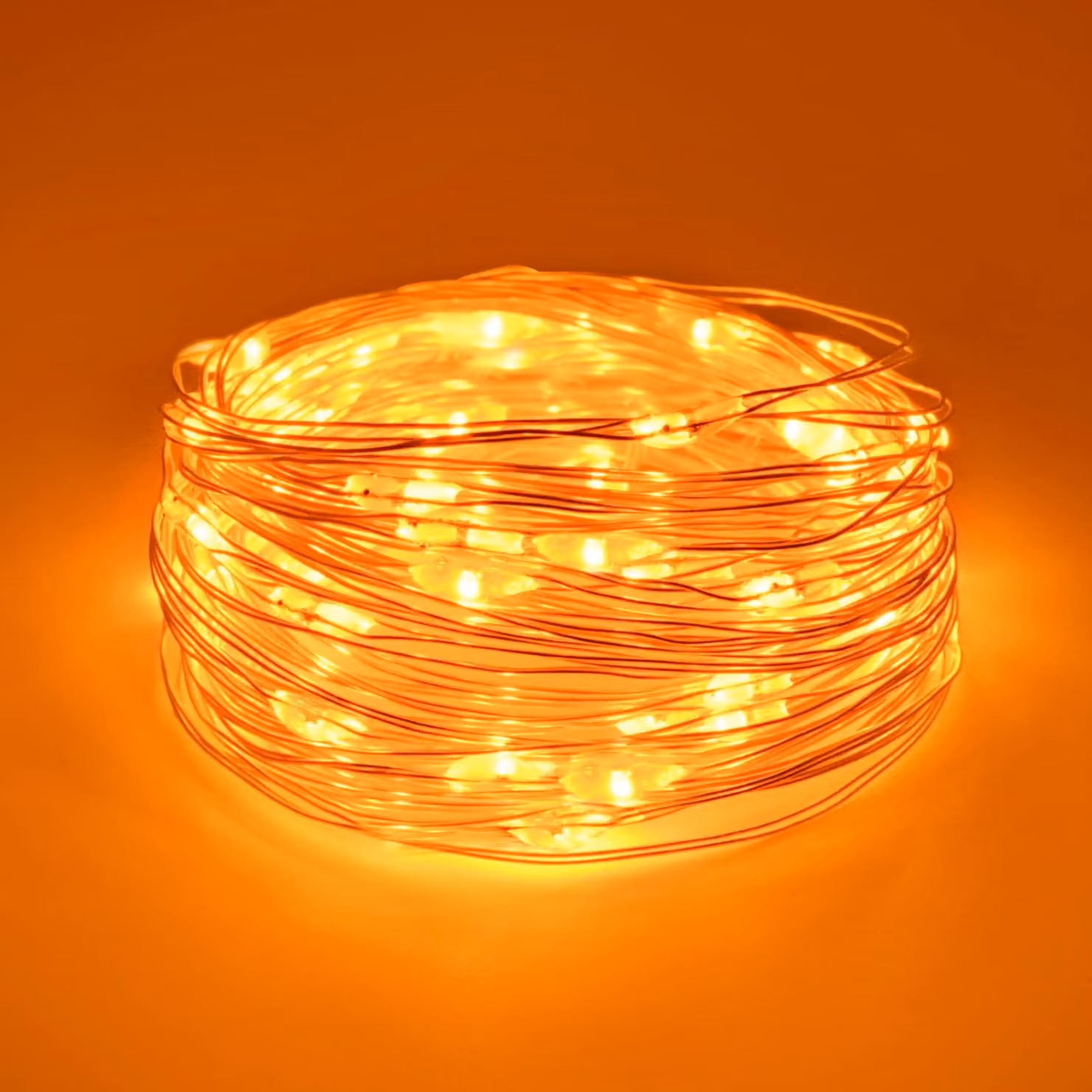 Catena luminosa da 5 metri, con 50 LED arancioni, alimentata a batteria, per uso interno