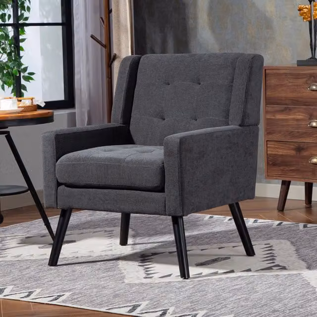 Poltrona imbottita capitonné con seduta ergonomica e gambe in legno massello, lino grigio scuro