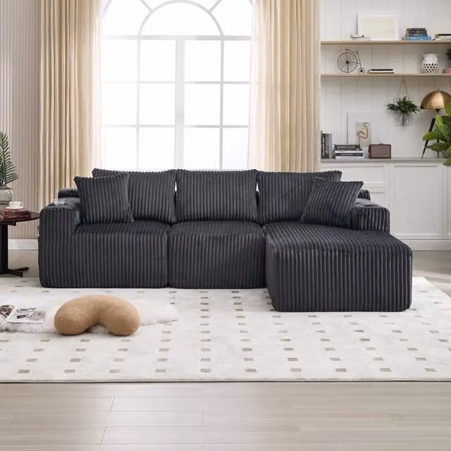 Divano modulare MIVRAY a L con chaise longue, rivestimento in velluto a coste grigio, completo di 5 cuscini, tasche laterali e portabevande, L/P/H: 257 x 162 x 90 cm