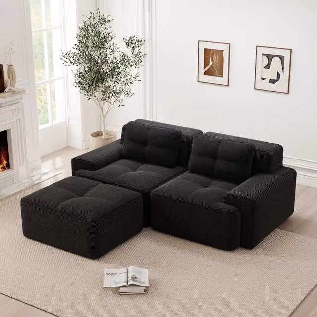 Divano modulare a L con seduta profonda e design senza braccioli con ottomana in velluto a coste nero per soggiorno