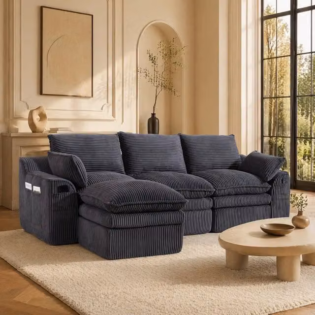 Divano modulare ULEVR 263x167x85 cm con pouf, tasche laterali e cuscini, velluto a coste grigio scuro